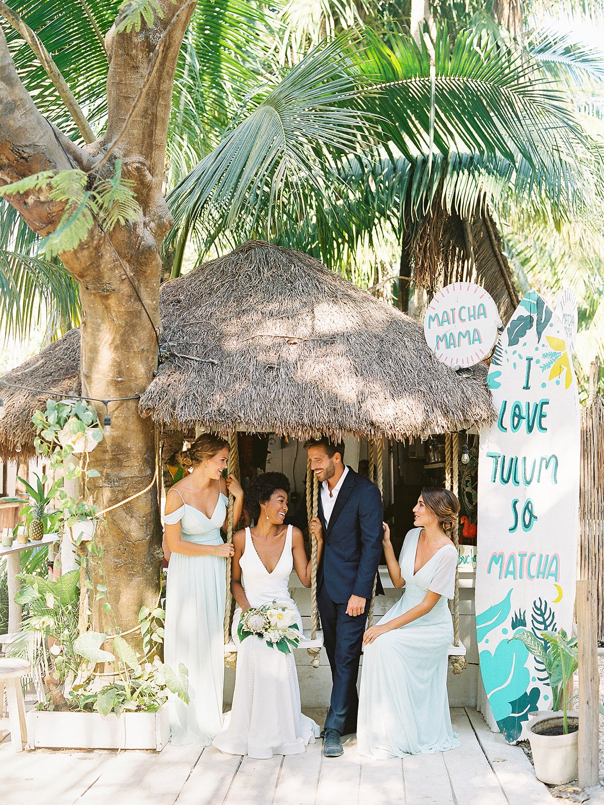We’re Obsessed with Weddings in Tulum–Here’s Why! We took Kleinfeld Bridal wedding dresses and Kleinfeld Bridal Party bridesmaids dresses to Tulum, Mexico for a fun photoshoot on the beach full of flowers, sun, sand and fun!