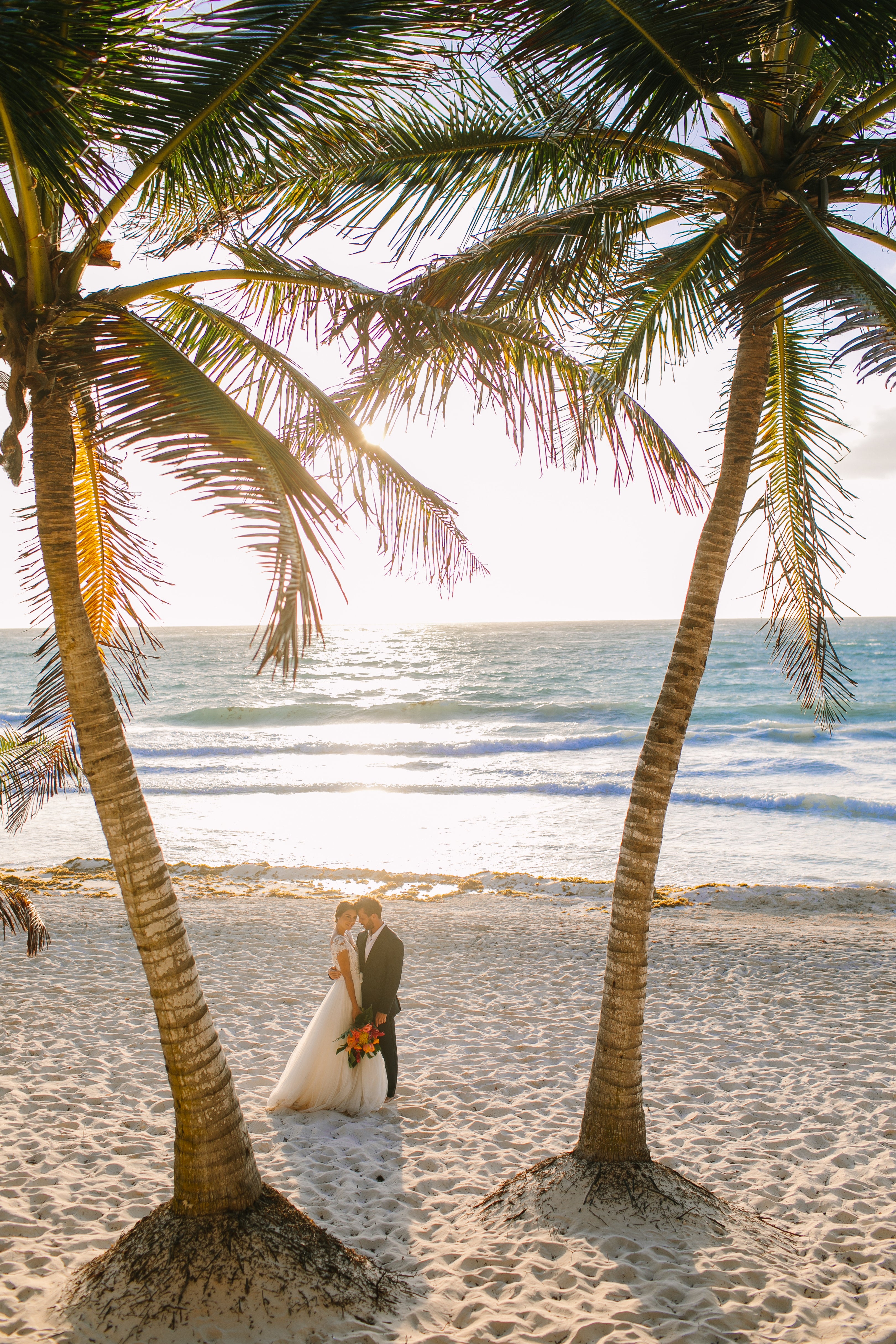 Tulum Weddings Are Unbelievably Romantic—Here's Proof: We took Kleinfeld Bridal wedding dresses and Kleinfeld Bridal Party bridesmaids dresses to Tulum, Mexico for a fun photoshoot on the beach full of flowers, sun, sand and fun!