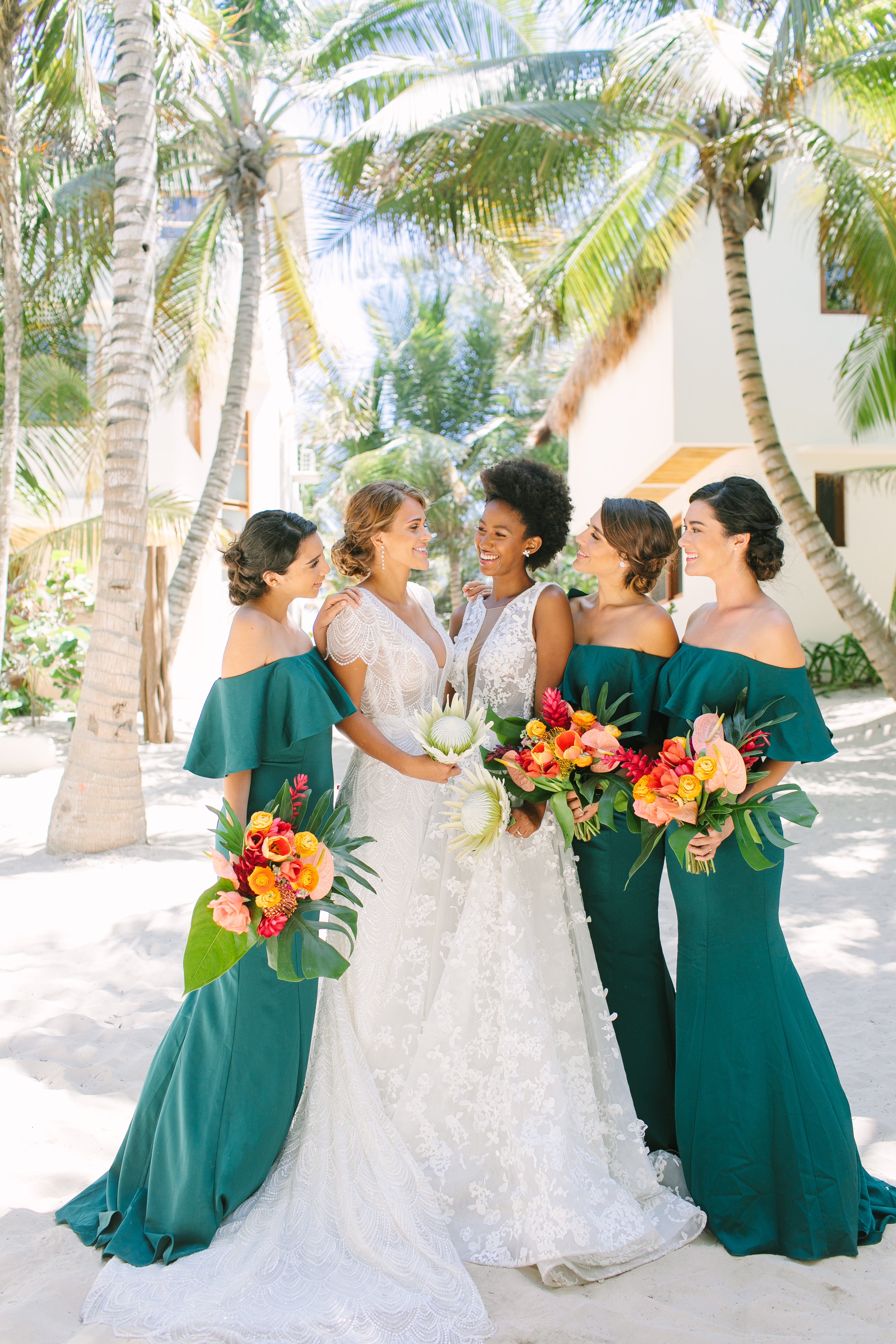 Affordable bridesmaids dresses perfect for destination weddings—We took Kleinfeld Bridal wedding dresses and Kleinfeld Bridal Party bridesmaids dresses to Tulum, Mexico for a fun photoshoot on the beach full of flowers, sun, sand and fun!