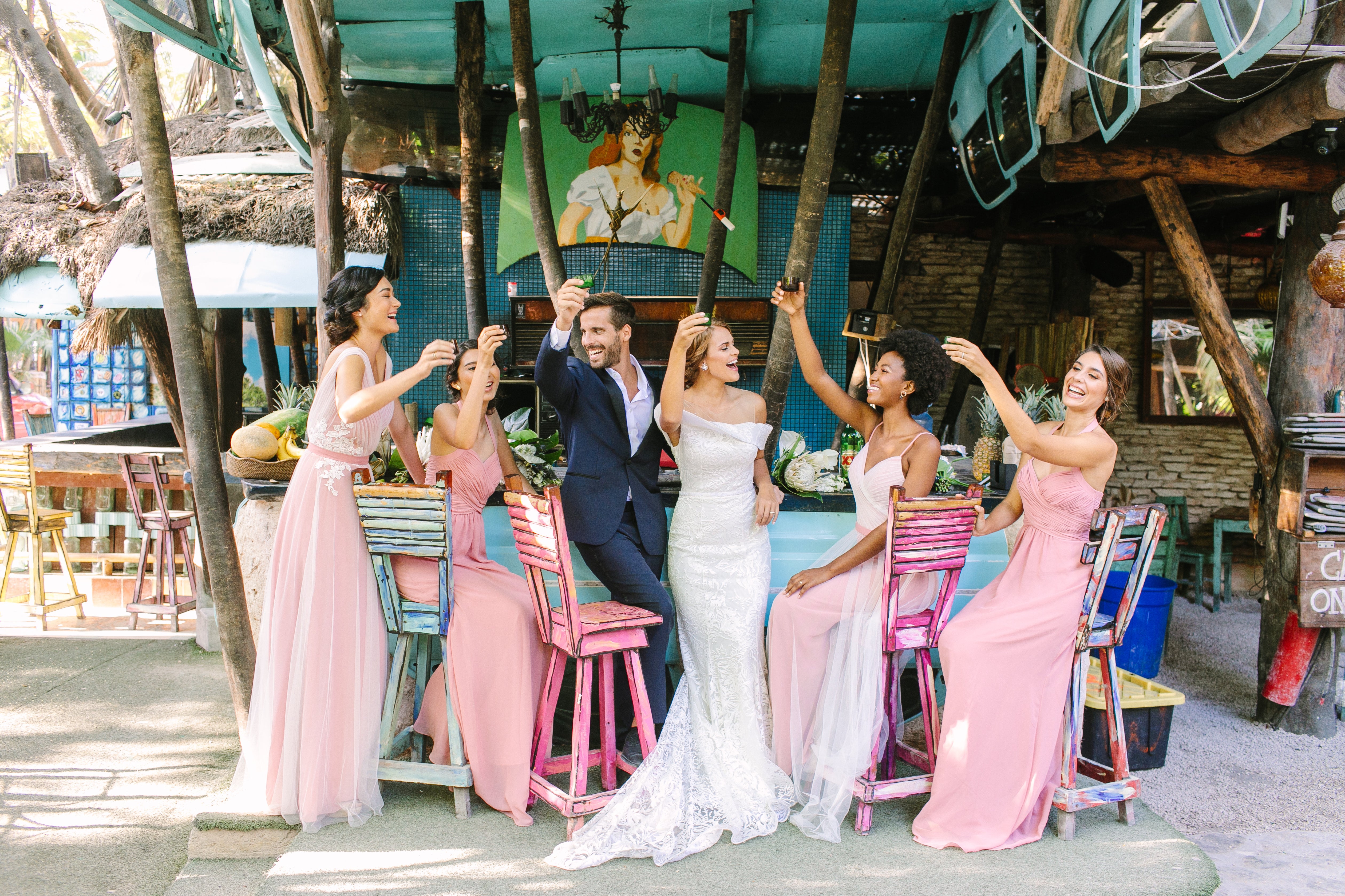 7 tips for wedding photos you'll love: We took Kleinfeld Bridal wedding dresses and Kleinfeld Bridal Party bridesmaids dresses to Tulum, Mexico for a fun photoshoot on the beach full of flowers, sun, sand and fun!