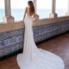 Sleeveless v-neckline lace embroidered crepe sheath wedding dress with sheer bodice by Pronovias x Kleinfeld - Image 2