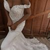 Romantic Off-shoulder Wedding Dress With Scalloped Train by Essense of Australia - Image 1