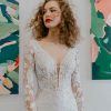 Long Sleeve Beaded Lace Bodice With Stretch Cape Skirt Wedding Dress by Martina Liana - Image 1
