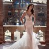 Cap Sleeve V-neckline Mermaid Wedding Dress with Lace Bodice and Ruffled Tulle Skirt by Pronovias x Kleinfeld - Image 1