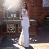 Sleeveless Illusion High Neck Sheath Wedding Dress with Beaded Bodice by Pronovias x Kleinfeld - Image 1