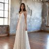 SIMPLE V-NECKLINE WEDDING DRESS WITH FLORAL SKIRT by All Who Wander - Image 1
