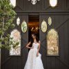 STRAPLESS PLUS SIZE A-LINE BOHEMIAN WEDDING GOWN WITH ORGANIC-SHAPED FLORAL DETAILS by All Who Wander - Image 1