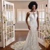 HIGH-NECK LACE WEDDING DRESS WITH SHEER DETAILS by Essense of Australia - Image 1