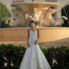 Spaghetti Strap V-neckline Fit And Flare Wedding Dress With Ruching by Lazaro - Image 1