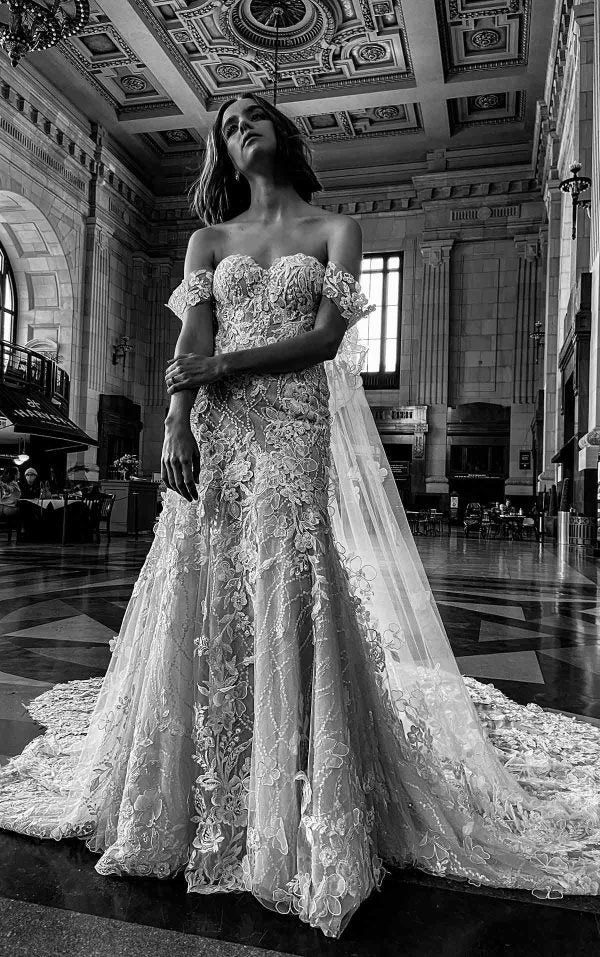 MODERN FLORAL FIT-AND-FLARE WEDDING DRESS WITH DETACHABLE CAPE by Martina Liana Luxe - Image 1