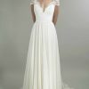 Cap Sleeve V-neckline A-line Wedding Dress With Lace Bodice And Flowing Skirt by Augusta Jones - Image 1