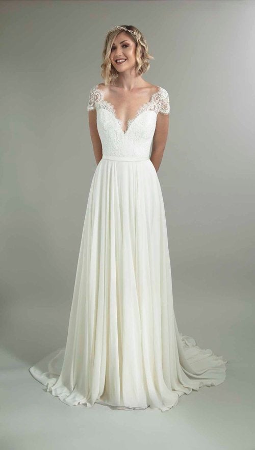 Cap Sleeve V-neckline A-line Wedding Dress With Lace Bodice And Flowing Skirt by Augusta Jones - Image 1