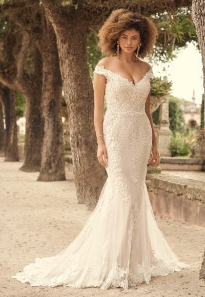 Romantic Lace Wedding Gown Featuring A Statement Illusion Train by Maggie Sottero