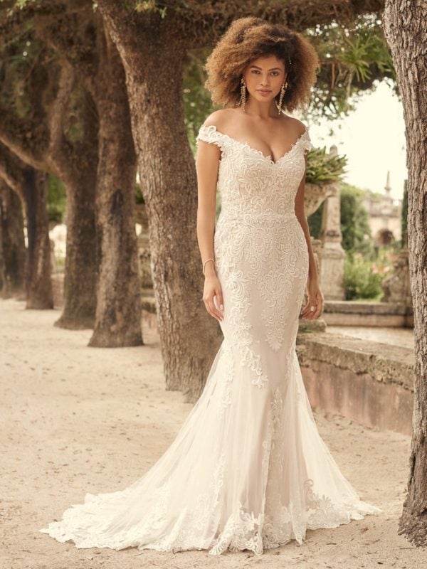 Romantic Lace Wedding Gown Featuring A Statement Illusion Train by Maggie Sottero - Image 1