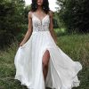 MODERN A-LINE BOHO WEDDING DRESS WITH MINIMALIST STRAPS AND PLUNGING V-NECK by All Who Wander - Image 1