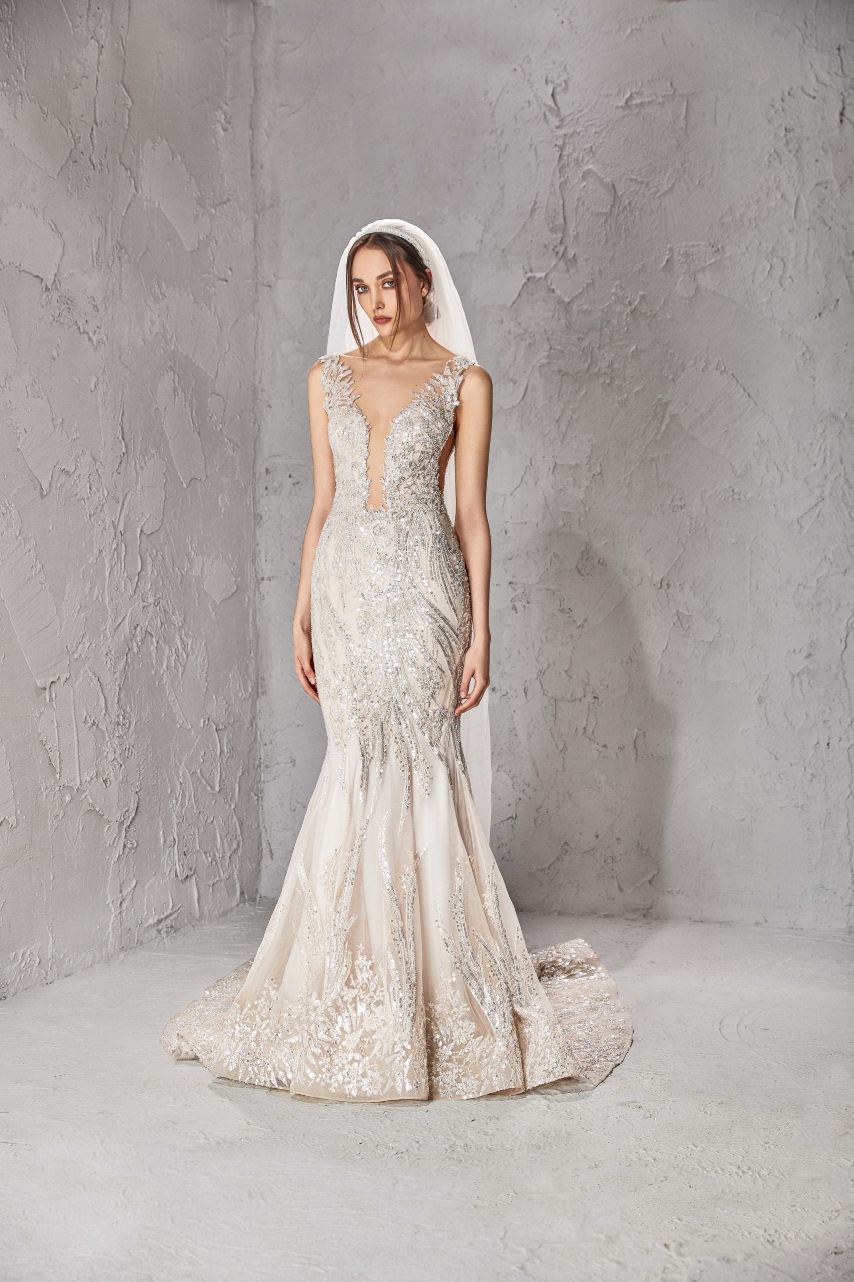 Sleeveless Mermaid Wedding Dress With Plunging V Neckline And Open Back