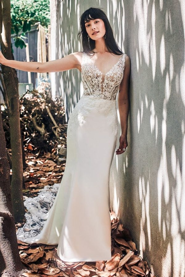 Sleeveless Fit And Flare Wedding Dress With V-neckline And Illusion Bodice by Madison James - Image 1
