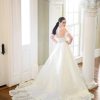 Off The Shoulder Ball Gown Wedding Dress With A Lace Bodice And Shaped Train by Martina Liana Luxe - Image 2
