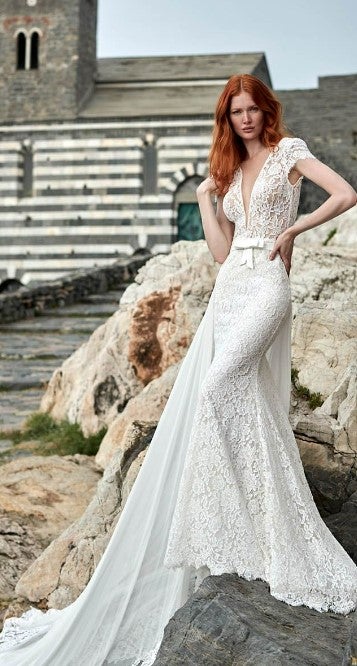 Lace Fit And Flare Wedding Dress With V-neckline And Cap Sleeves by Maison Signore - Image 1