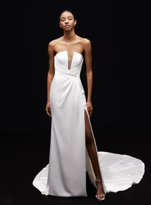 Strapless Satin Sheath Wedding Dress With Draped Bodice And Bow And Front Slit by Alyne by Rita Vinieris - Image 1
