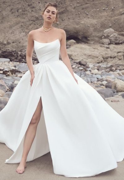 Strapless Ballgown Wedding Dress With Draped Bodice And Side Slit With Pockets by Maggie Sottero