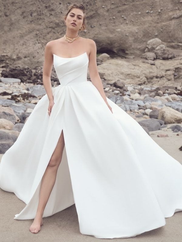 Strapless Ballgown Wedding Dress With Draped Bodice And Side Slit With Pockets by Maggie Sottero - Image 1