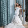 Fit And Flare Wedding Dress With Textured Skirt And Detachable Off The Shoulder Straps by Estee Couture - Image 1