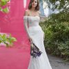 Long Sleeve Off The Shoulder Sheath Wedding Dress With Sequined Tulle by Madison James - Image 1