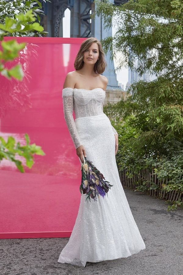 Long Sleeve Off The Shoulder Sheath Wedding Dress With Sequined Tulle by Madison James - Image 1