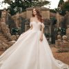 Off The Shoulder Ball Gown Wedding Dress With Corset Back With Bow by Disney Fairy Tale Weddings Collection - Image 1