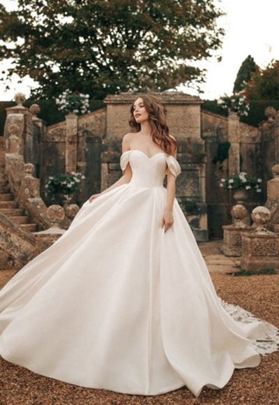 Off The Shoulder Ball Gown Wedding Dress With Corset Back With Bow by Disney Fairy Tale Weddings Collection