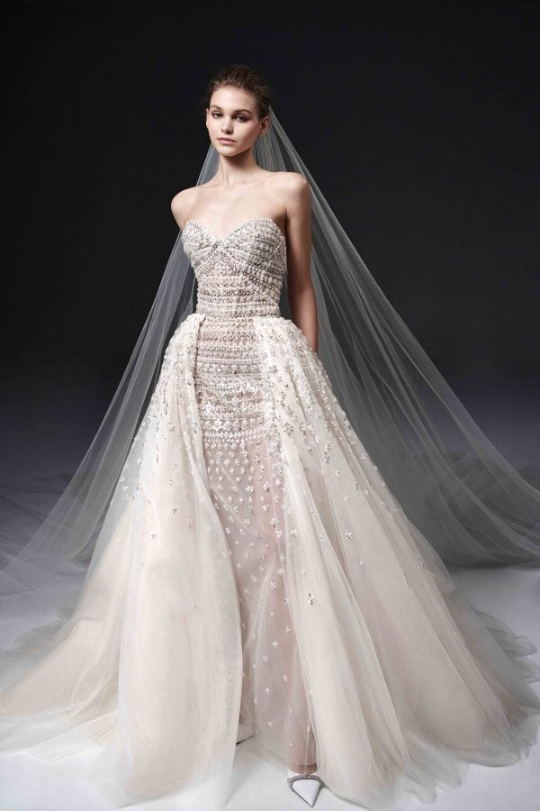 Beaded Strapless Fit And Flare Wedding Dress With Detachable Overskirt by Nicole + Felicia - Image 1