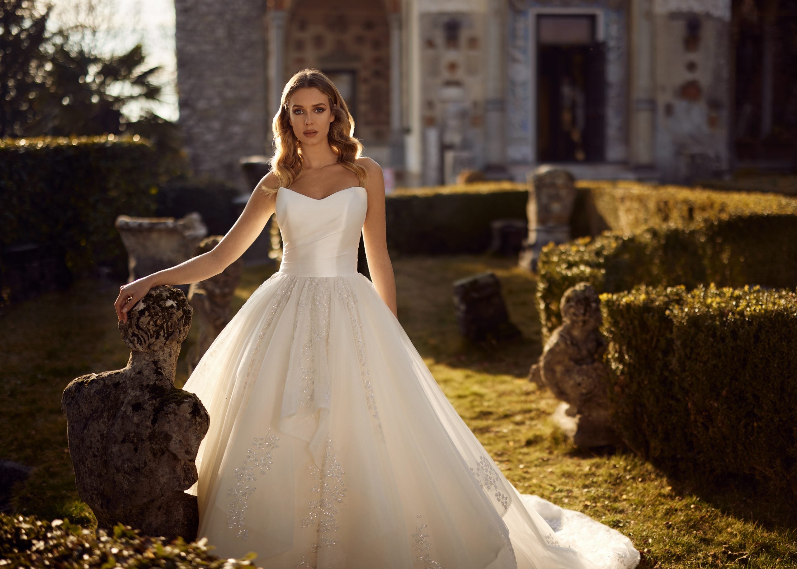 Premium Photo | Beautiful young bride choosing perfect wedding dress in  store for her best day concept of chosen the right dress