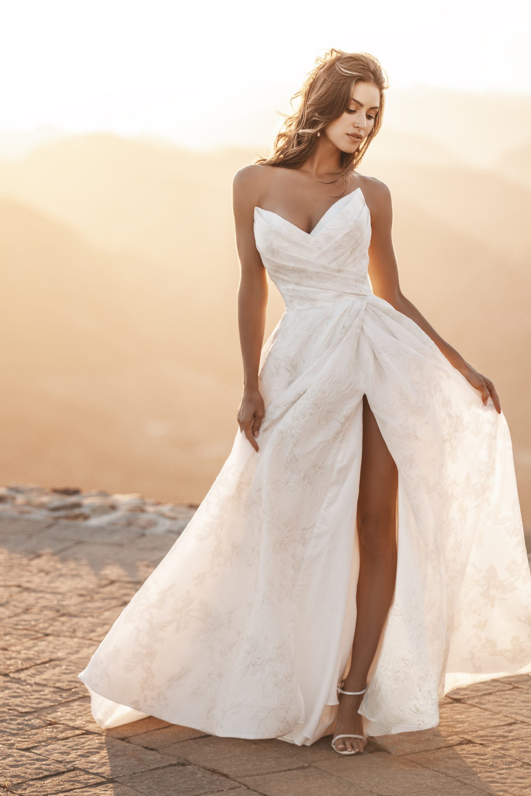 Ruched Strapless A-line Gown With A Pleated Slit by Allure Bridals - Image 1