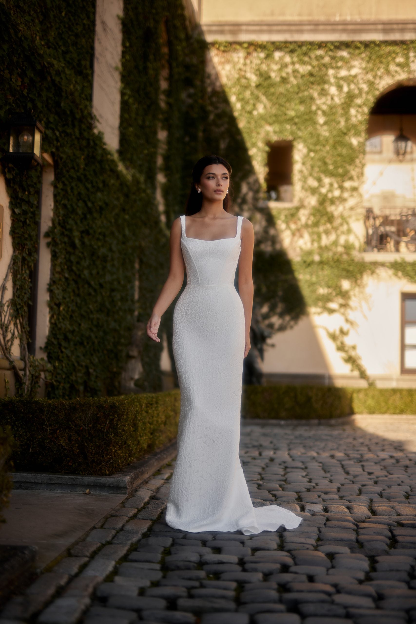 Square-Neck Jacquard Sheath Gown With Bow by Enaura Bridal - Image 1