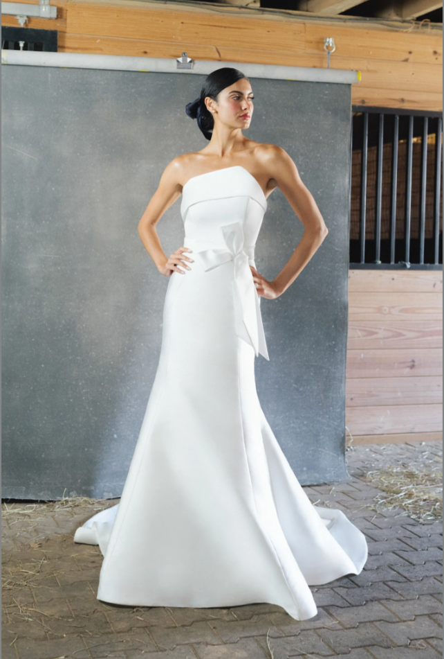 Chic And Modern Trumpet Gown With Asymmetrical Neckline And Bow by Anne Barge - Image 1