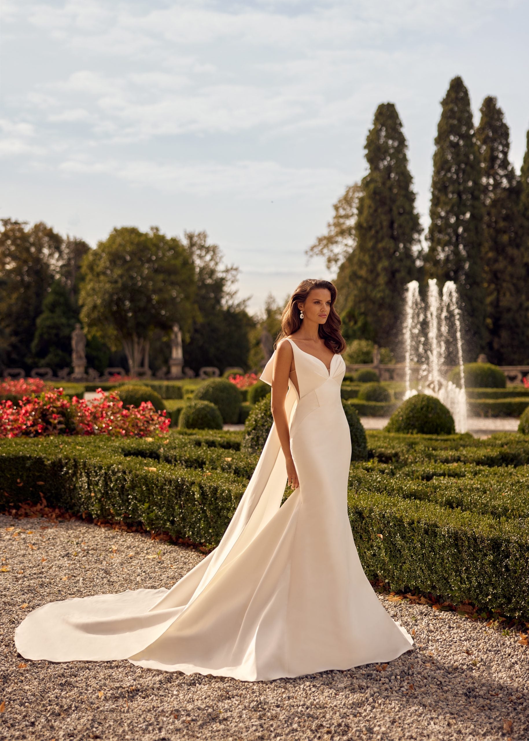 Chic And Simple V-Neck Fit-and-Flare Gown With Bow by Randy Fenoli - Image 1