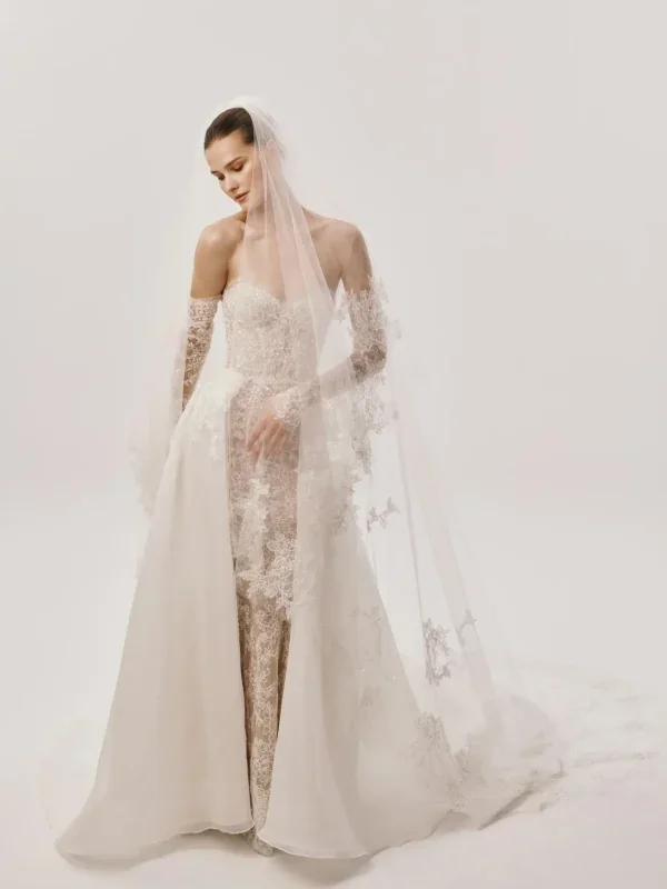 Strapless Lace Fit-And-Flare Wedding Dress With Detachable Sleeves And Overskirt by Nicole + Felicia - Image 1