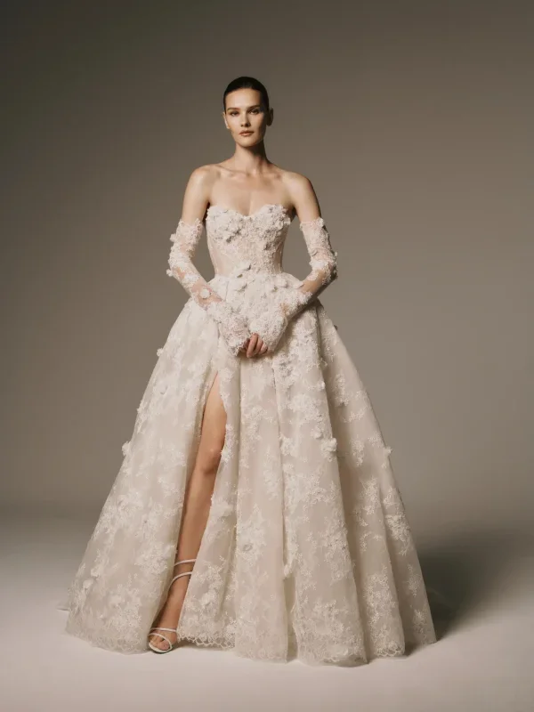 Dramatic And Romantic Lace Ball Gown With Detachable Sleeves by Nicole + Felicia - Image 1