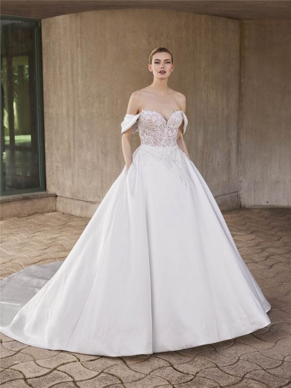 Regal And Romantic Off-The-Shoulder Ball Gown With Pockets And Buttons by Pronovias - Image 1