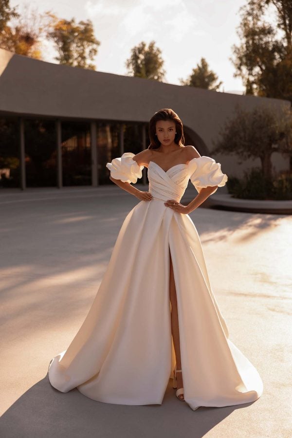 Dramatic Silk Ball Gown With Slit And Detachable Puff Sleeves by Demetrios - Image 1