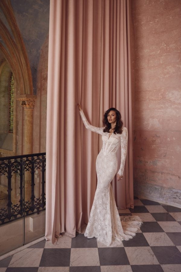 Plus-Size Long Sleeve Lace Sheath Wedding Dress With Pearl Buttons by Love by Pnina Tornai - Image 1