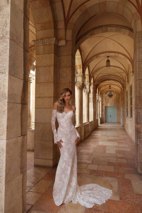 Romantic Off-The-Shoulder Long Sleeve Lace Fit-And-Flare Wedding Dress by Pnina Tornai - Image 1