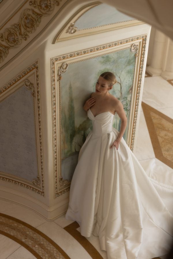 Plus-Size Chic And Classic Strapless Silk Ball Gown With Pockets And Buttons by Verdin Bridal - Image 1