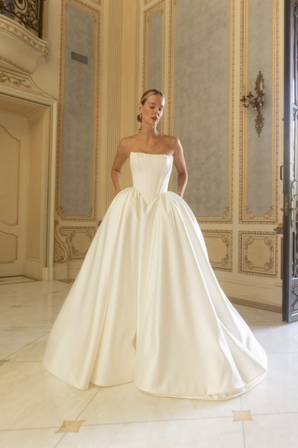 Plus-Size Chic And Contemporary Basque-Waist Satin Ball Gown With Pockets by Verdin Bridal - Image 1