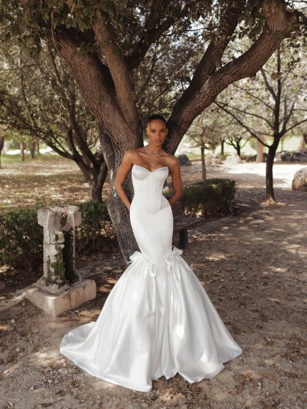 Modern And Minimalist Satin Mermaid Wedding Dress With Bows by Love by Pnina Tornai - Image 1