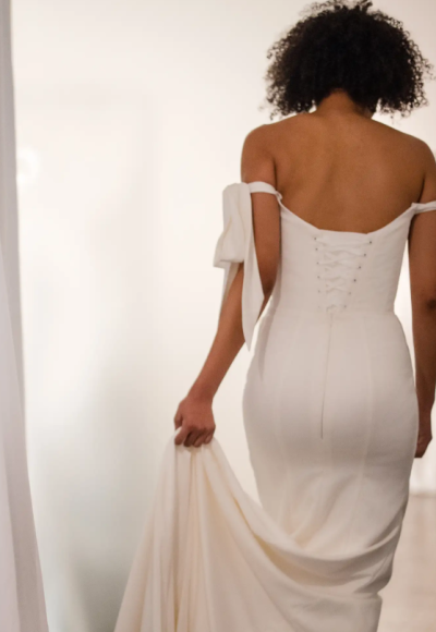 Plus-Size Minimalist Sheath Wedding Dress With Off-The-Shoulder Bows by Love by Pnina Tornai - Image 2